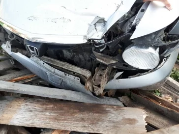 Фото: В Кемерове иномарка влетела в забор частного дома 3