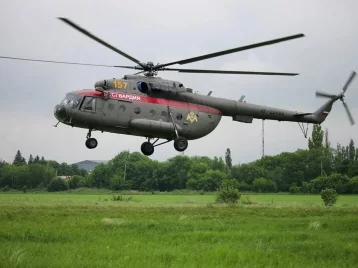 Фото: В Кузбассе для поиска пропавших в лесу бабушки с внуком задействовали вертолёт Росгвардии 1