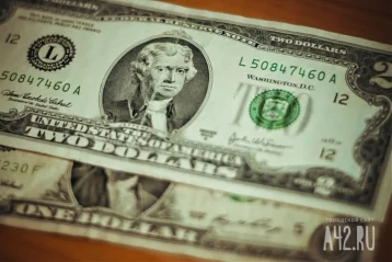 Фото: Доллар на Мосбирже упал ниже 53 рублей впервые с июня 2015 1