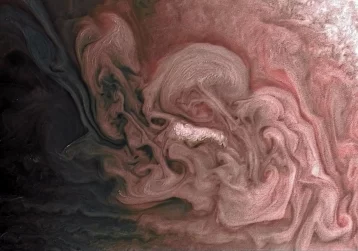 Фото: NASA опубликовало снимок розовой бури на Юпитере 1
