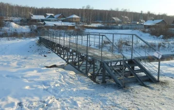 Фото: В Заводском районе Кемерова построили пешеходный мост 1