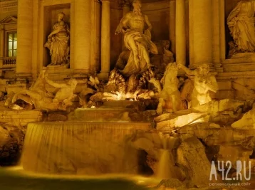 Фото: В Риме художник-вандал вылил краску в фонтан Треви 1