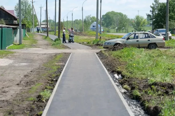 В Кемерове завершилось асфальтирование тротуаров в жилом районе Пионер