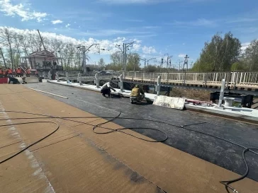 Фото: В Кемерове на путепроводе в Пионере началось асфальтирование подходов 4
