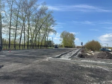 Фото: В Кемерове на путепроводе в Пионере началось асфальтирование подходов 5