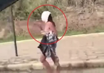 Фото: Прогулка обнажённой бразильянки с юбкой на голове попала на видео 1