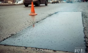 «Можно пробить колёса»: автолюбитель пожаловался на дорожные ямы на выезде из Кемерова