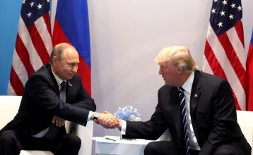 Фото: Опубликовано видео с тайными жестами Трампа Путину 1