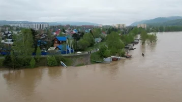 Фото: Подтоплен 21 участок: мэр Междуреченска рассказал о ситуации в городе 1