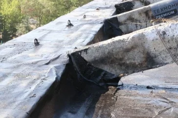 Фото: В мэрии Кемерова рассказали о ремонте крыши горевшего на Красной улице дома 3