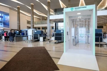 Фото: В сибирском аэропорту установили дезинфицирующий коридор: как он работает 1